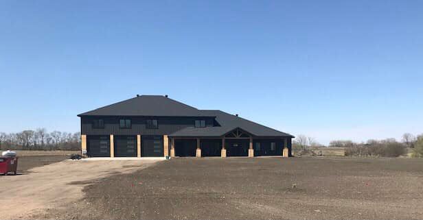 All black North Dakota shouse with wood accents